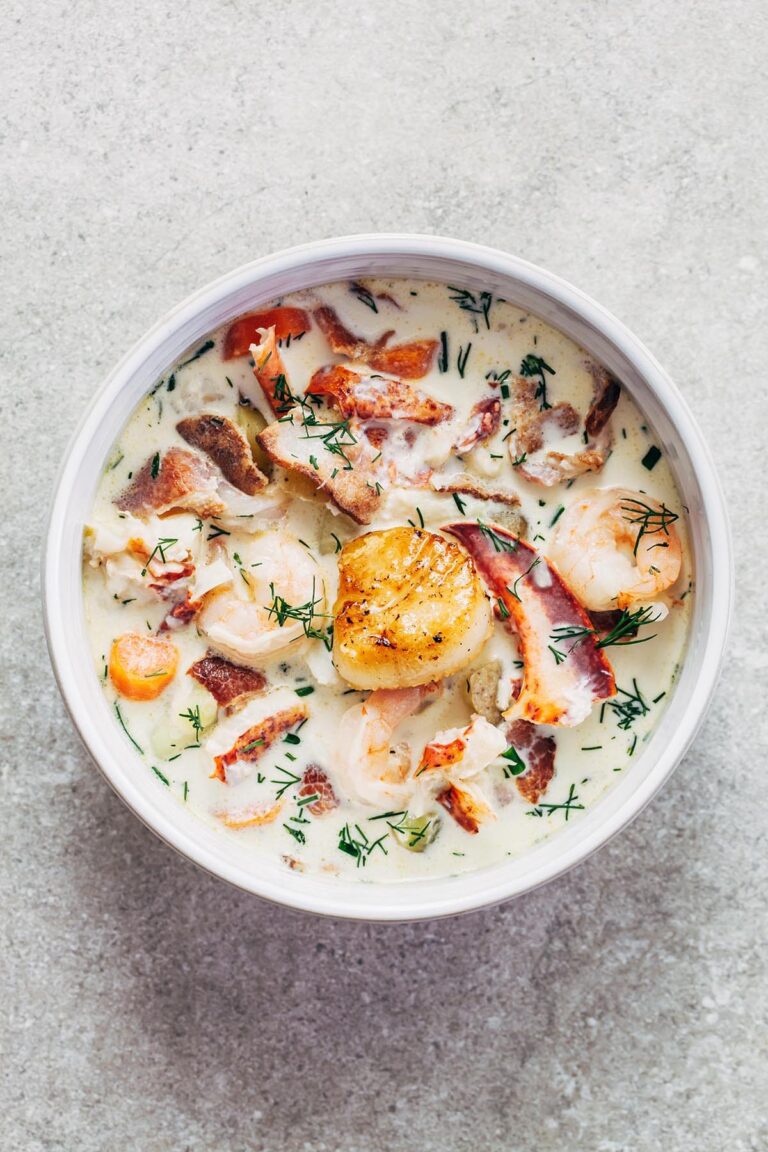 A bowl of Nova Scotia seafood chowder topped with a pan-seared scallop.